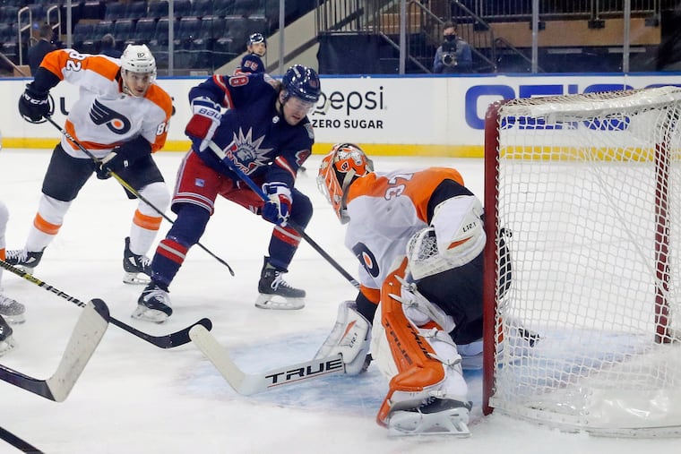 The New York Rangers' Brendan Lemieux (48) scores the first goal in a 9-0 win, beating Flyers goalie Brian Elliott. The Flyers set a dubious record by allowing seven goals in a period (the second).