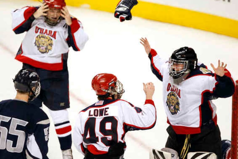 Cardinal O'Hara goalie Jeffrey Holland celebrates with teammate Joshua Lowe as the final buzzer sounds. Holland turned away 19 Malvern Prep shots in recording a 2-0 shutout.
