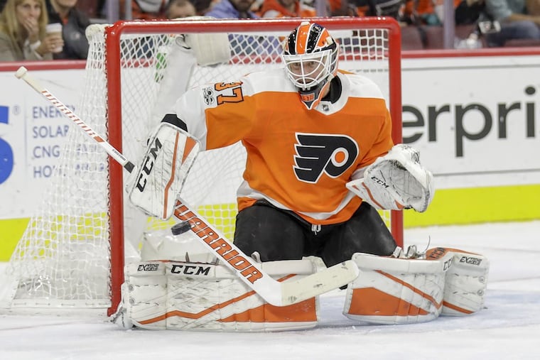 Flyers goalie Brian Elliott makes a save against the Arizona Coyotes during the second period.