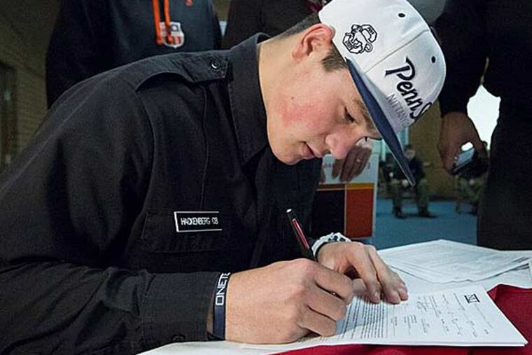 Christian Hackenberg, highly touted quarterback from Fork Union Military Academy in Virginia, signs his letter of intent to attend Penn State University. (Joe Hermitt/PennLive.com)