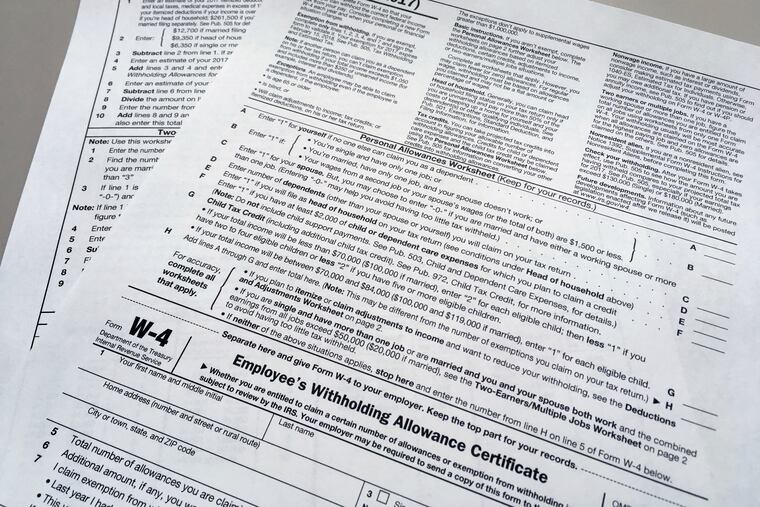 This Feb. 1, 2018 file photo shows an IRS W-4 form.