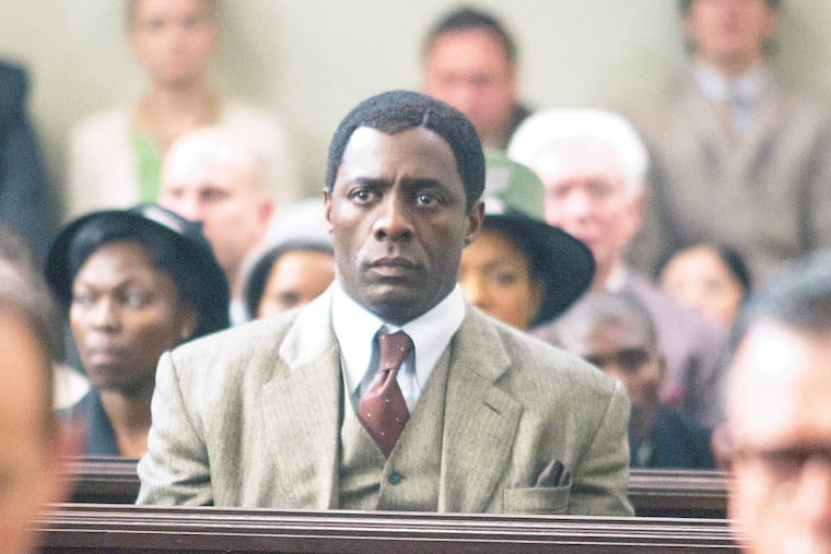 This photo released by The Weinstein Company shows, Idris Elba, center, as Nelson Mandela, in the film, "Mandela: Long Walk to Freedom." The movie opens Friday, Nov. 29, 2013. (AP Photo/The Weinstein Company, Keith Bernstein)