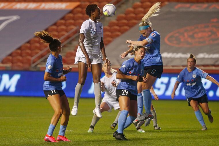 Sky Blue's Ifeoma Onumonu rising up for a header between Chicago's Sarah Gorden (11), Bianca St. Georges (29) and Julie Ertz during the second half of Wednesday's NWSL Challenge Cup semifinal against the Red Stars.
