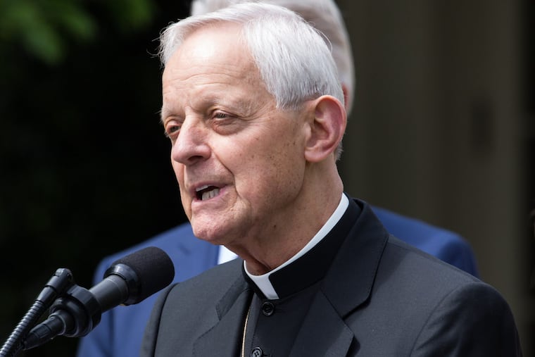 Cardinal Donald Wuerl praying at White House ceremony last year. His name has been removed from a Pittsburgh area high school after he was cited in grand jury's clergy-abuse report. (Cheriss May/Sipa USA/TNS)