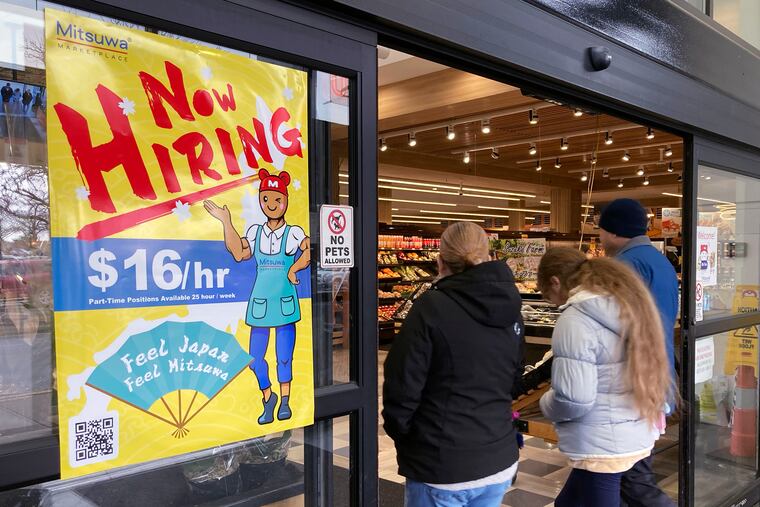 A hiring sign at a grocery store in Arlington Heights, Ill., in January.