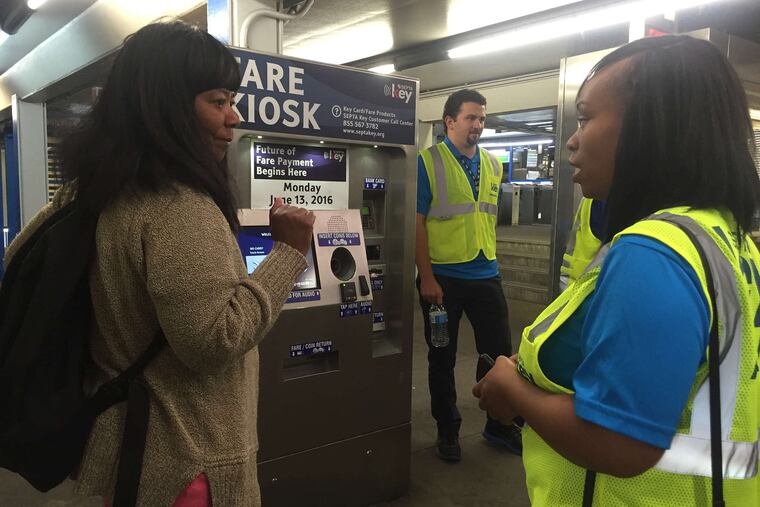Shirley Thomas gets advice from Norma Clark, a SEPTA ambassador, about the new smart fare card. The early adopter program is phasing in SEPTA Key, the smart card that will replace tokens and TransPasses for subways, trolleys, buses, and rail.