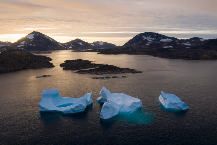 Large Icebergs float away as the sun rises near Kulusuk, Greenland. A joint European-U.S. satellite mission to improve measurements of sea level rise is being launched from Vandenberg Air Force Base in California on Saturday Nov. 22, 2020. The Sentinel-6 Michael Freilich satellite, named after the late director of NASA's Earth Science Division, is seen as a crucial tool for monitoring the impact of global warming on coastlines, where billions of people face the risk of encroaching oceans in the coming decades.