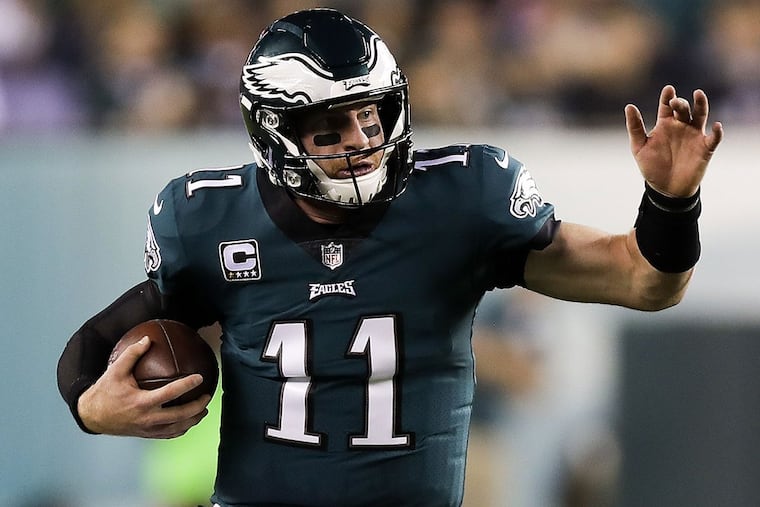 Eagles quarterback Carson Wentz runs with the football against the Washington Redskins.