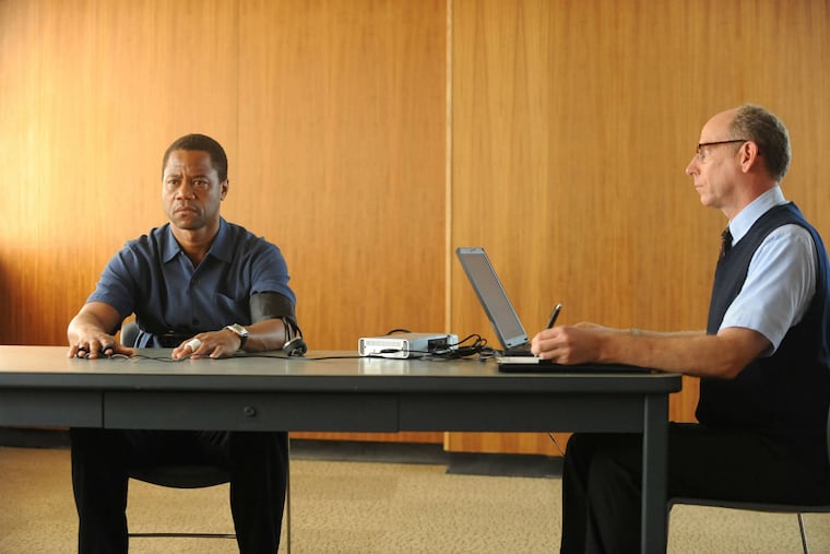 (L) Cuba Gooding Jr. as O.J. Simpson with Joseph Buttler playing the administrator of a lie-detector test, in a scene from FX’s “The People v. O.J. Simpson: American Crime Story,” which begins Tuesday, Feb. 2