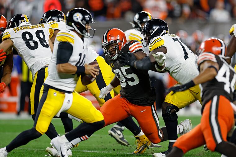 Browns defensive end Myles Garrett (95) rushes Steelers quarterback Mitch Trubisky (10) but can't get around James Daniels (78) during the first half on Thursday.
