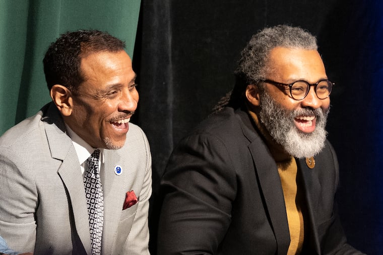 Philadelphia Superintendent Tony B. Watlington Sr. (left) and Philadelphia school board President Reginald Streater shared a laugh during on event about the state of Philadelphia schools during at Thomas A. Edison High School in Philadelphia on Wednesday.