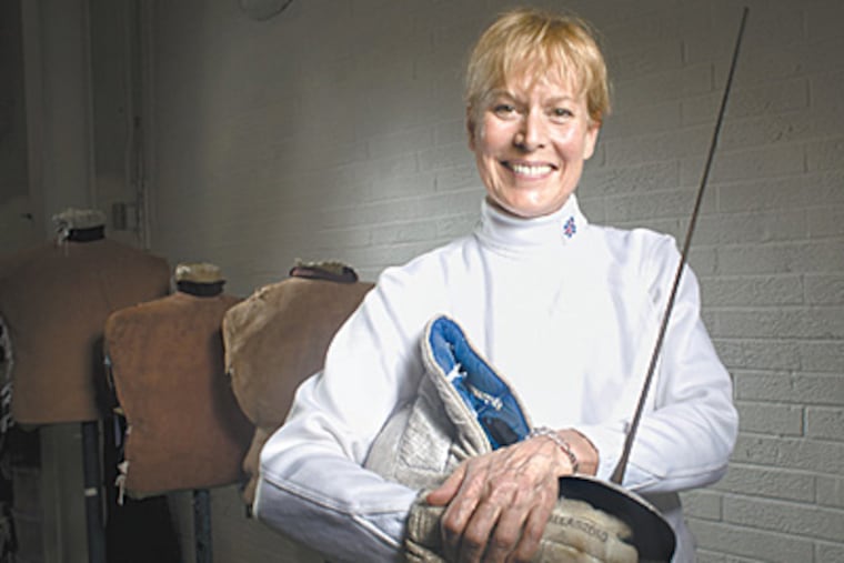 Swedesboro's Jane Eyre, seen here in her Cherry Hill studio, is an international fencing champion. (Ed Hille/Staff)