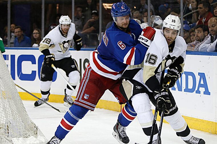 Rangers defenseman Anton Stralman defends Penguins center Brandon Sutter. (Kathy Willens/AP)