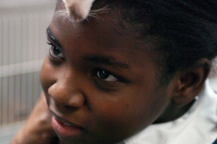 Ebun Laniya and her rat pal, Myrtle, at the R.W. Brown Center.