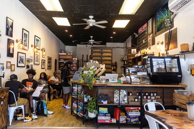 People seated inside Avenues Coffee in Philadelphia, Pa., on Wednesday, Oct., 4, 2023.