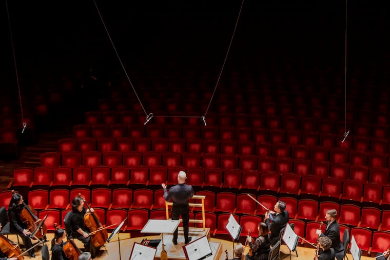 Philadelphia Orchestra's Music Director Yannick Nezet-Seguin talks to the live web broadcast audience at the start of their concert in an empty Verizon Hall Mar. 12, 2020. The Orchestra cancelled all rehearsals, performances, and events through March 23 to limit community transmission of the coronavirus. The program, which included Beethoven’s Symphonies No. 5 and 6, was shown in a live webcast and scheduled to be broadcast later on public radio and television.