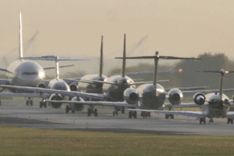 A $6.4 billion plan would lengthen two of the airport's runways and build a fifth. Tinicum Township would lose 72 homes. (Michael S. Wirtz / Staff Photographer)