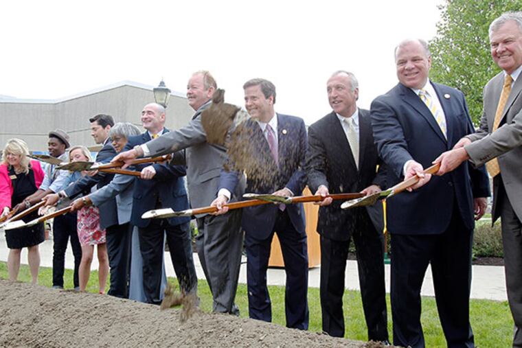 (From right) GCC President Dr. Frederick Keating, NJ State Senate President Stephen Sweeney, Nick Burzichelli, NJ State Senator Donald Norcross, Freeholder Robert Damminger, Freeholder Lyman Barnes, Virginia Scott, Dr. Jim Lavender, student Natalie Quindlen, student Christian Reed and Judy Atkinson break ground on the Gloucester County College addition on Friday, May 9, 2014.
(AKIRA SUWA/Staff Photographer)