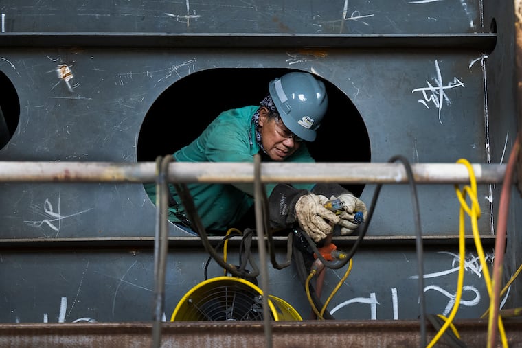A worker at the Hanwha shipyard in South Philadelphia in July.