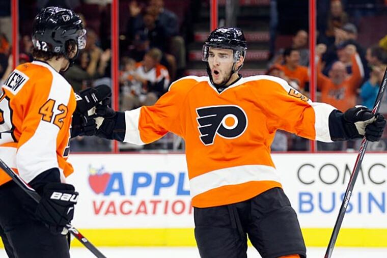Shayne Gostisbehere celebrates after a goal against the Devils. (Yong Kim/Staff Photographer)