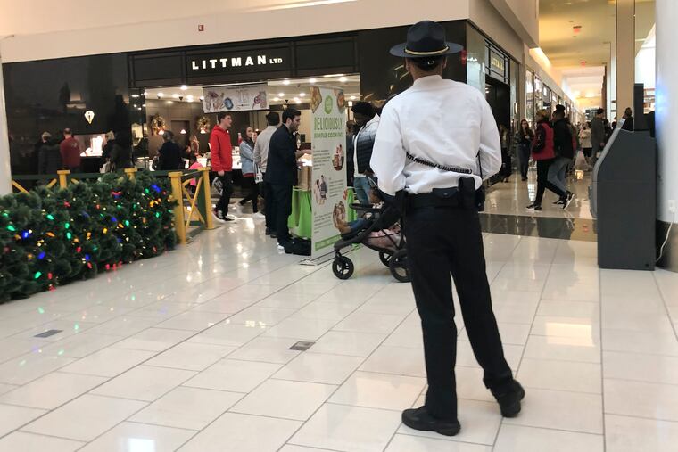 A Cherry Hill Mall security member stands on patrol inside the mall on Thursday, December 26, 2019. Teens in the past have been known to cause mayhem after Christmas and this year they have to be accompanied by an adult.