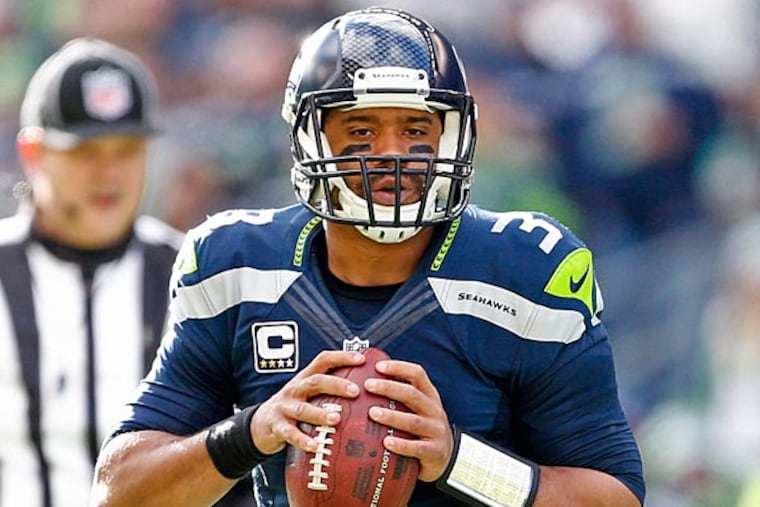 Seattle Seahawks quarterback Russell Wilson (3) looks to pass against the Arizona Cardinals during the first quarter at CenturyLink Field. (Joe Nicholson/USA Today)