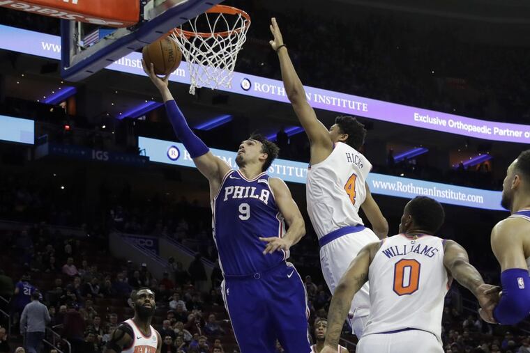 Dario Saric (9) puts up a shot against the Knicks.