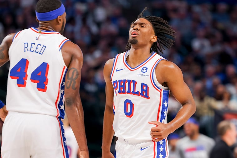 Sixers guard Tyrese Maxey celebrates with Paul Reed during the first half against the Mavericks in Dallas.