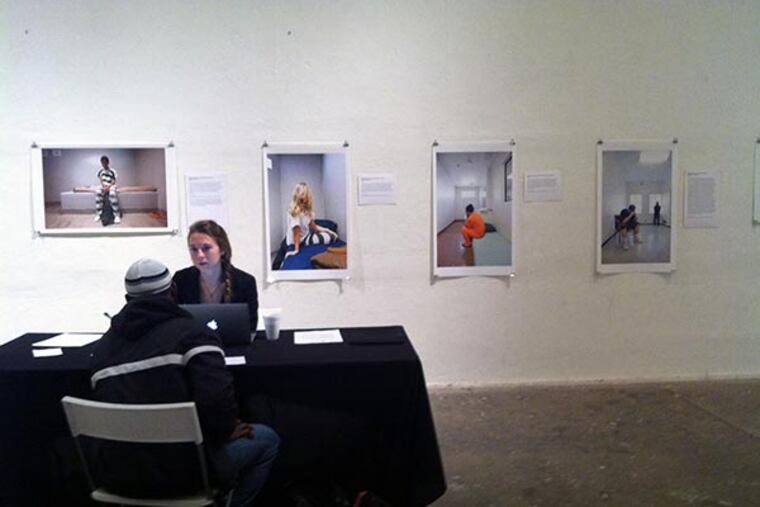 Anna Kessler, a Temple University law student and volunteer with Philadelphia Lawyers for Social Equity, helps a man to get his juvenile record expunged. (Stephanie Farr / DAILY NEWS STAFF)