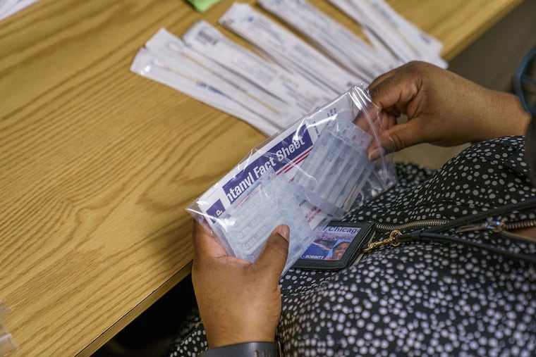 Tasha Trask-Bobbitt putting together fentanyl testing strip packets for the Chicago Department of Public Health on Dec. 9, 2021.