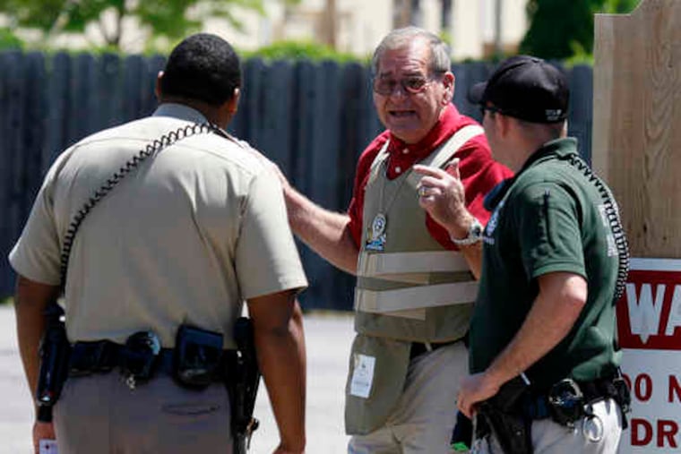 Wichita police secure the gated entrance of Women's Health Care Services after the shooting death of an abortion provider.