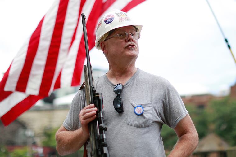 Judd Stoud, Cleveland holds a .270 rifle at Settlers Landing during the RNC in Cleveland, Ohio Monday July 18 2016.