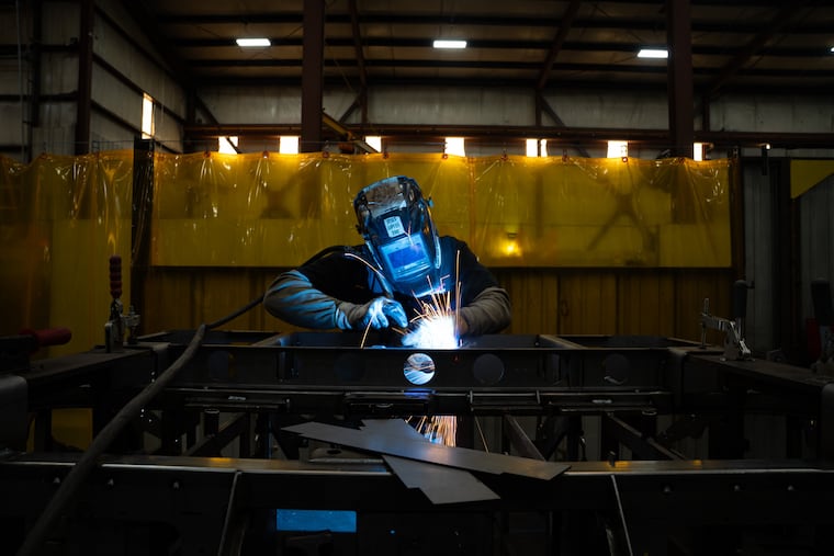 A welder is seen inside the Allen Engineering Corp. plant Monday, March 16, 2026, in Paragould, Ark. The owner says Trump's tariffs have wreaked havoc on his company.