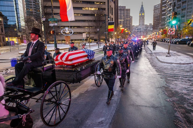 The funeral caisson for Philadelphia Police Officer Andy Chan arriving at the Cathedral Basilica of SS. Peter and Paul on Tuesday morning.