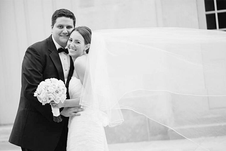 Caitlin and Ryan exchanged vows before the Rev. Edward O'Donnell at Old St. Joseph's Church in Philadelphia. Caitlin couldn't stop looking at Ryan's face as she walked down the aisle toward him: "I don't think I'll ever forget seeing him be so happy to see me." Ryan said: "It was a really good moment. It made it seem like after all the work we had put into it . . . it was really happening now." (Gabrielle Elizabeth Photography)