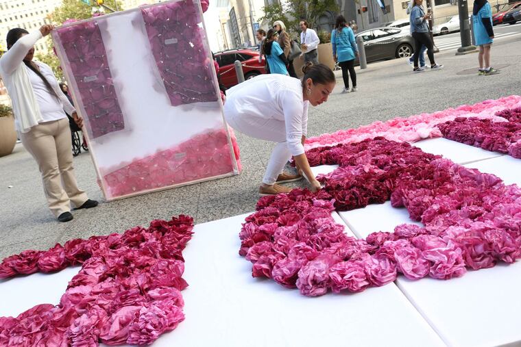 Artist Michelle Angela Ortiz spells out "Libertad," meaning "Freedom," with paper flowers outside of Philadelphia City Hall in October 2017. It was part of a protest by the Shut Down Berks Coalition, which has called for the closure of the facility in Leesport, Pa.