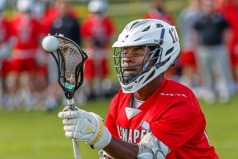 Bryce Reece is all concentration as he accepts a pass from a teammate against Shawnee in April.