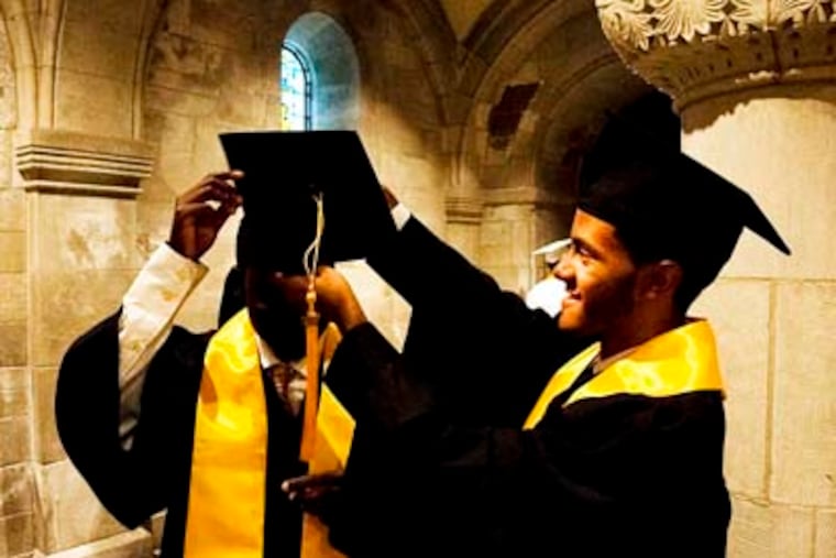 Students participating in 12+, a nonprofit that helps low-income Philadelphia high schoolers achieve access to college educations through counseling and scholarships, graduated on Wednesday from Kensington Culinary Arts High School at a ceremony held at Temple's Performing Arts Center. In this photo, 12+ participant Danjerry Santiago helps fellow participant Danford Nanjero with his cap. (ABI REIMOLD / STAFF PHOTOGRAPHER)