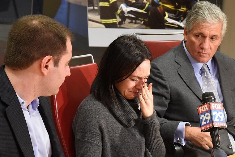 “I felt I was dying,” Allison Friedman said in announcing a suit against the owner of a building that fell on an adjacent site, in which she was shopping. Her lawyer Robert J. Mongeluzzi is at right.