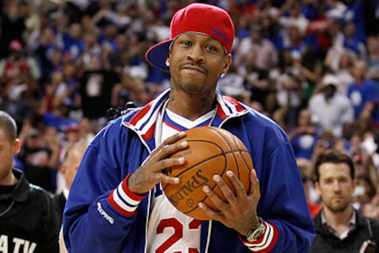 Former Sixer Allen Iverson holds the game ball before Wednesday night's Game 6. (Yong Kim/Staff Photographer)