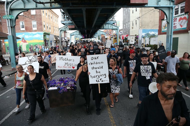 Marchers make their way up Kensington Avenue during the �March in Black� on International Overdose Awareness Day in Philadelphia, PA on August 31, 2017.