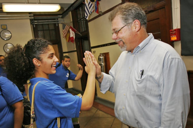 Math teacher Brian Malloy gets a good-luck high-five from Bodine High 11th-grader Nilofar Kazi on the day before he was named teacher of the year. He is a 30-year veteran of the district’s classrooms. (Alejandro A. Alvarez / Staff Photographer)