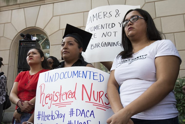 Olivia Vazquez, Anel Medina, and Maria Castaneda, all DACA recipients, speak at a rally outside the Philadelphia offices of the U.S. Justice Department.