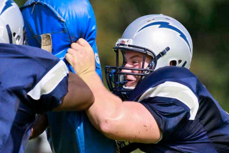 Timber Creek's Billy Bilo works out in blocking drills. The lineman is part of an experienced front wall for the Chargers.