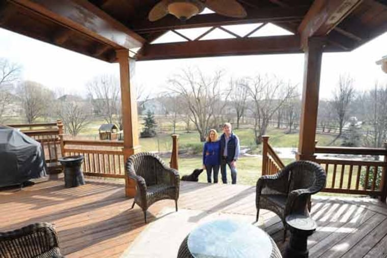 The Recchiutis' deck was turned into a partially covered porch that looks out onto their three-quarter-acre yard.