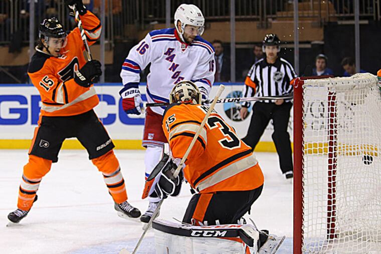 Flyers goalie Steve Mason is unable to make a save during the first period. (Adam Hunger/USA Today Sports)