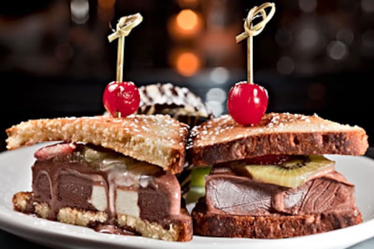 Toasted pound cake is used to sandwich ice cream, kiwi, and strawberries for one of the standout desserts. (DAVID M WARREN / Staff Photographer)