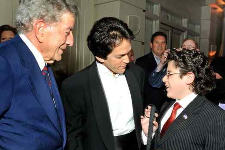 Tony Bennett (left) and Mitch Albom chat with Rocco Fiorentino, 12, after the premiere party for Albom's book "Have a Little Faith" at the Park Hyatt at the Bellevue. Rocco will host Eagles kicker David Akers for an event at his middle school Tuesday.