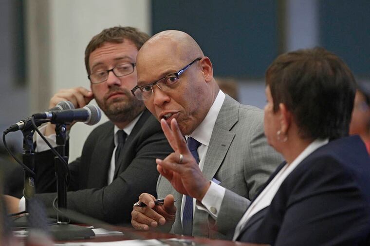 Superintendent William R. Hite, center, seated between Matt Stanksi (L), CFO, and Marge Neff (R), Chairwoman of the SRC, answers a question posed to him by Councilwoman Cindy Bass during the school district's annual pitch for more funding on May 26, 2015. ( Michael Bryant / Staff Photographer )