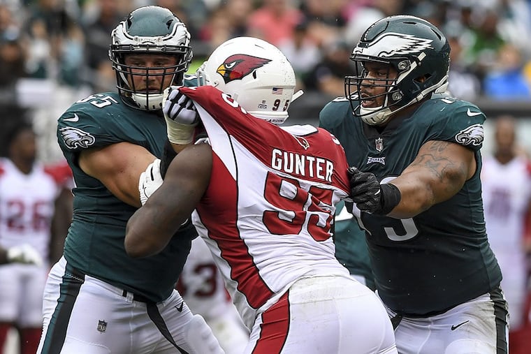 Eagles tackle Lane Johnson (left) and guard Brandon Brooks double team Arizona Cardinals defensive lineman Rodney Gunter.